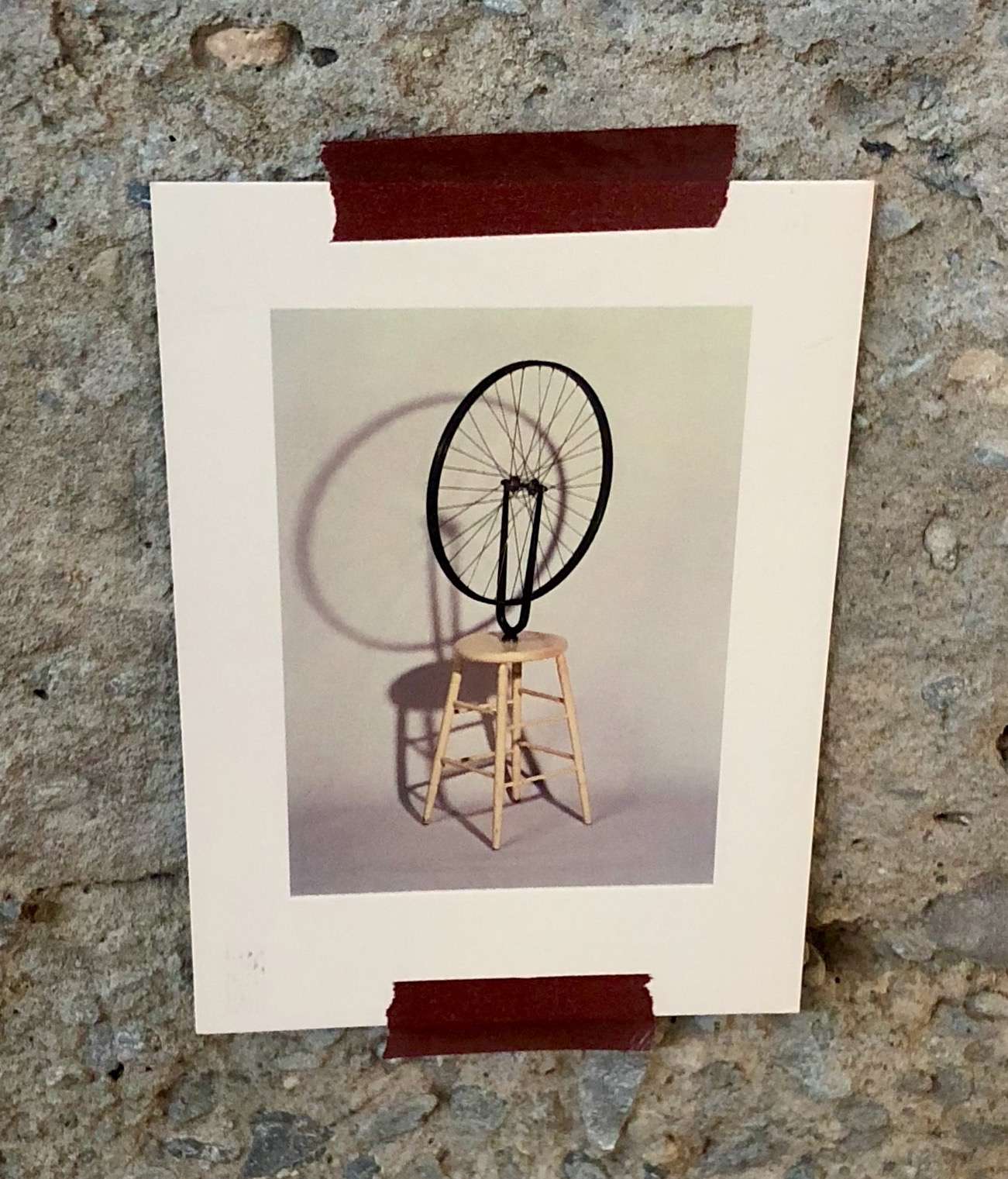 Image of postcard delivered by Sarah Cannon to Notion's office. The postcard, of Marcel Duchamp's 'Bicycle Wheel Sculpture' is reportedly hanging in their office...