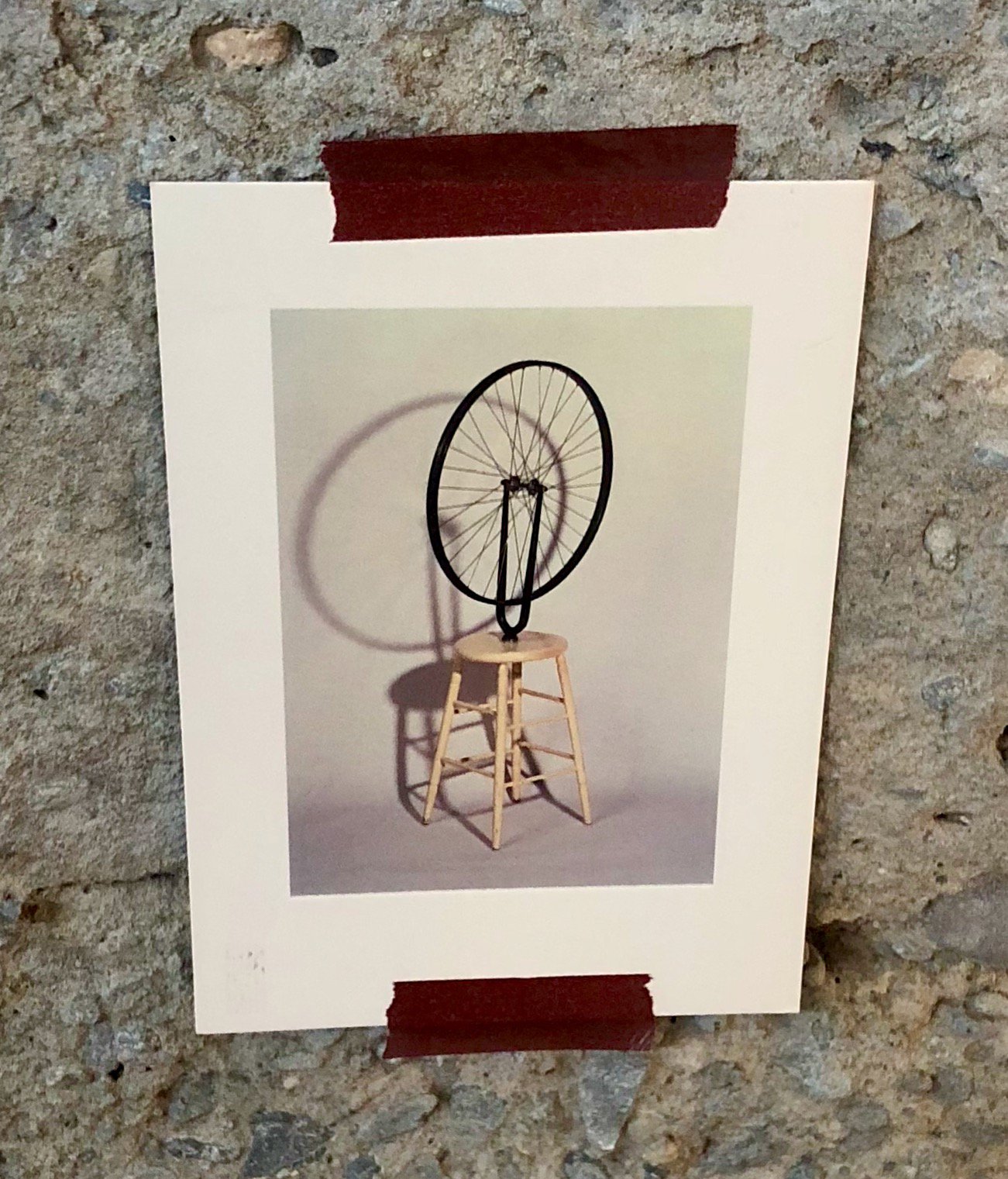 Image of postcard delivered by Sarah Cannon to Notion's office. The postcard, of Marcel Duchamp's 'Bicycle Wheel Sculpture' is reportedly hanging in their office...